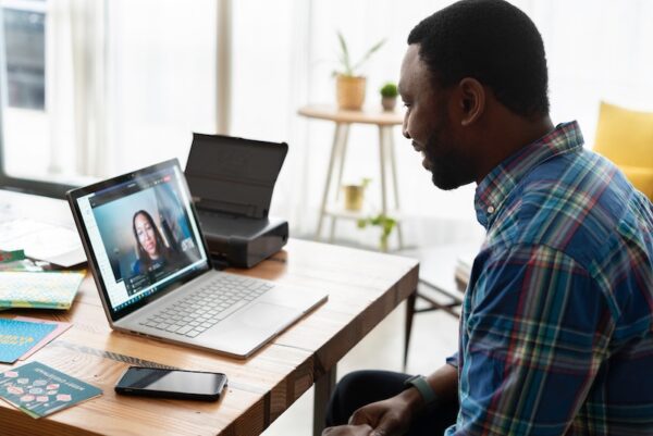 Person in a virtual meeting on their laptop.