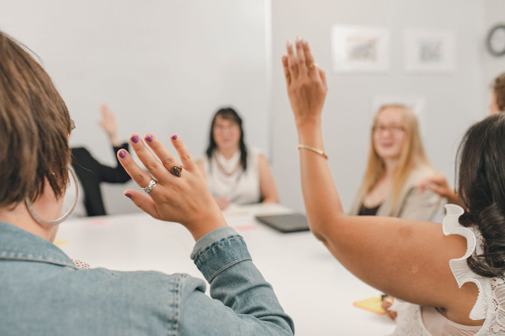 group shot of the Untapped team at a boardroom table.